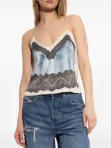 Top Diesel T-Asty de satén color celeste con encaje negro en escote y ruedo, tirantes finos regulables y logo metálico en la espalda.