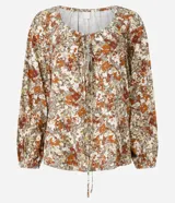 Blusa de manga larga confeccionada en viscosa con cuello redondo, lazo en el escote, abertura debajo del escote y estampado abstracto.