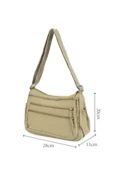 Bandolera color beige con múltiples bolsillos con cierre en la parte frontal y trasera, y bolsillos ajustables en los laterales.