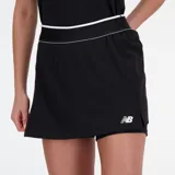 Pollera deportiva negra con short interior blanco, cintura elastizada con detalle de línea blanca y logo de la marca en blanco en la parte inferior.