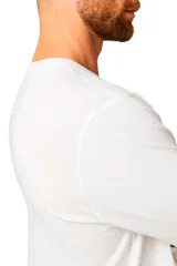Remera de manga larga blanca con logotipo reflectante de Cat Workwear en el pecho, diseñada para visibilidad y seguridad.
