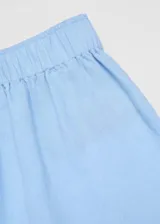 Pantalón crop color beige, de lino y viscosa, con corte wide leg y cintura elástica.