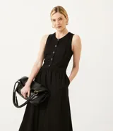 Vestido midi negro de punto orly, con abotonadura delantera y escote redondo.