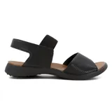 Sandalias bajas negras con elástico en el tobillo y capellada de cuero.