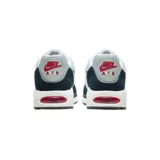 Championes Nike Air Max Correlate de hombre, color gris claro con detalles en azul marino y rojo. Presentan el logo de Nike en blanco y suela blanca con cámara de aire visible en rojo.