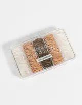 Set de 200 gomitas elásticas de silicona en colores marrón, beige y transparente, presentadas en una caja organizadora transparente.