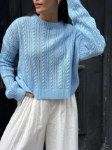 Sweater tejido de punto color rosa con diseño de ochos.