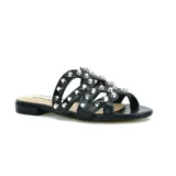 Sandalias bajas Korium color negro con tiras de cuero sintético y tachas plateadas.