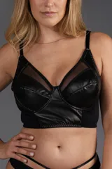 Corset corto con aro confeccionado en cuerina y tul negro. Espalda ancha con ganchos regulables reforzados y breteles elásticos regulables.