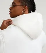 Hoodie masculino de algodón con felpa, color azul marino, de corte relaxed, con capucha ajustable, bolsillo canguro y manga larga.