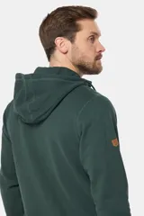 Canguro con cierre y capucha color bordó, confeccionado en felpa de algodón y poliéster.