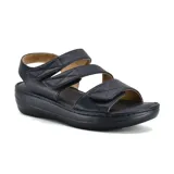 Sandalias negras de cuero con plataforma y tiras con velcro.