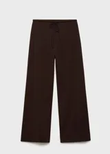 Pantalón largo de mujer color beige, de corte ancho y tiro alto, con cintura elástica y lazo ajustable.