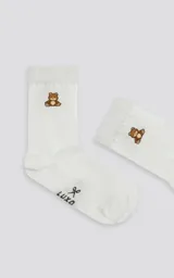 Medias blancas de algodón con diseño de oso de peluche y logo de la marca Luxo.