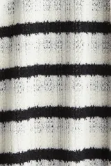 Pantalón de punto fino suave a rayas horizontales blancas y negras, con cintura elástica y cordón para ajustar. Piernas amplias.