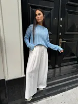 Sweater tejido de punto color rosa con diseño de ochos.