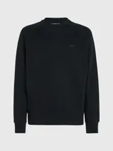 Buzo negro de algodón modal suave con cuello redondo, puños y bajo de canalé. Presenta un logo de Calvin Klein en la misma gama de tonos en el pecho.