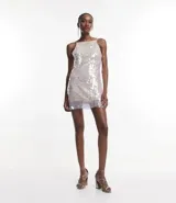 Vestido corto con escote cuadrado y breteles finos ajustables, confeccionado en tejido de lentejuelas metalizadas con forro.