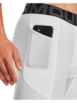 Shorts de compresión Under Armour HeatGear blancos, con pretina elástica con logo de la marca y bolsillo lateral.