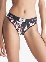 Bombacha bikini de algodón con estampado floral en tonos blanco y rojo sobre fondo negro. Cintura elástica con logo de Calvin Klein.