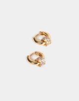 Aros tipo argolla bañados en oro con circonitas cúbicas.