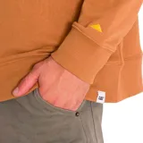 Buzo de frisa color crema con cuello redondo, puños y cintura acanalados. Estampado frontal con el logo de Caterpillar y la leyenda "Power Truck".