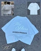 Remera color crema de corte holgado con estampado en la espalda que dice "Ittai Stars" en letras cursivas, "AN IBIZA PRODUCE" en mayúsculas y "Ittai Stars Department Gallery - Ibiza Edition" en letras pequeñas.