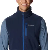 Chaleco de polar Columbia Fast Trek para hombre, color azul marino con cierre y detalles en azul eléctrico. Cuenta con cuello alto, bolsillos laterales con cierre y bolsillo en el pecho con cierre.