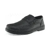 Zapato de vestir negro con detalle de tira sobre el empeine y suela gruesa.