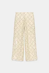 Pantalón de tiro alto con cintura elástica y lentejuelas.