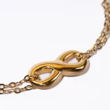 Pulsera dorada de doble cadena con dije del símbolo de infinito.