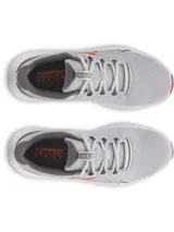 Championes Under Armour Charged Surge 4 para hombre, color gris con logo naranja.
