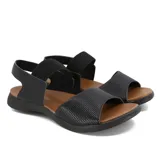 Sandalias bajas negras con elástico en el tobillo y capellada de cuero.