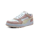 Championes Puma RBD Game Low de cuero color blanco con detalles en rosa y amarillo pastel.