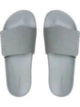 Ojotas grises con tira ancha de lona con logo de Calvin Klein en relieve.