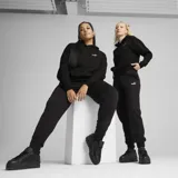 Pantalón de jogging negro de felpa francesa con cintura elástica ajustable con cordón, puños acanalados y logo de Puma bordado en blanco.