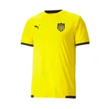 Camiseta de fútbol Puma del Club Atlético Peñarol, color amarillo con detalles en negro. Incluye logo de Puma, escudo del club y sponsor en el frente.