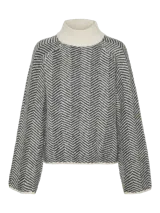 Suéter de punto grueso con cuello alto y mangas largas acampanadas, con diseño de espiga en tonos grises y blanco.
