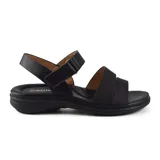Sandalias bajas negras de Korium con dos tiras anchas sobre el empeine y tira ajustable en el tobillo.