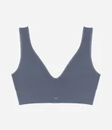 Soutien top gris de poliamida con acabado seamless, breteles anchos fijos, escote en V y etiqueta Lov.