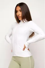 Campera blanca de poliamida con elastano, de corte ajustado, manga larga con orificio para el pulgar y cierre frontal.