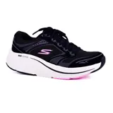 Championes deportivos Skechers Max Cushioning Elite 2.0, color negro con detalles en gris y fucsia. Confeccionados en malla transpirable y material sintético, con cordones, plantilla Air-Cooled Goga Mat y entresuela Ultra Go para máxima amortiguación.