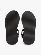 Sandalias de plataforma negras con suela dentada gruesa. Presentan tiras de tejido trenzado ajustables con velcro y un parche tonal con el logo de Tommy Jeans.