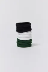 Pack de nueve gomitas de pelo elásticas, tres de color negro, tres de color blanco y tres de color verde oscuro.