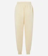 Pantalón jogger color amarillo claro, con cintura elástica y cordón de ajuste. Confeccionado en algodón con forro de polar.