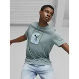 Remera verde de algodón con estampado de una ola y el logo de Puma en negro.