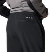 Pantalón de senderismo negro con detalles reflectantes, tecnología Omni-Shade™ UPF 50 y Omni-Shield™ para repeler la humedad. Cuenta con cintura elástica, cordón de ajuste interior, rodillas articuladas, bolsillos y cremalleras en las piernas.