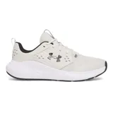 Championes Under Armour Charged Commit TR 4, color gris claro con logo negro y suela blanca.