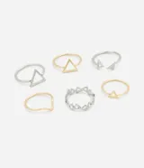 Set de seis anillos de metal en color dorado y plateado, con diseños de triángulos y montañas.