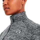 Remera Under Armour Tech de mujer, color gris jaspeado, de manga larga con medio cierre frontal y cuello alto.